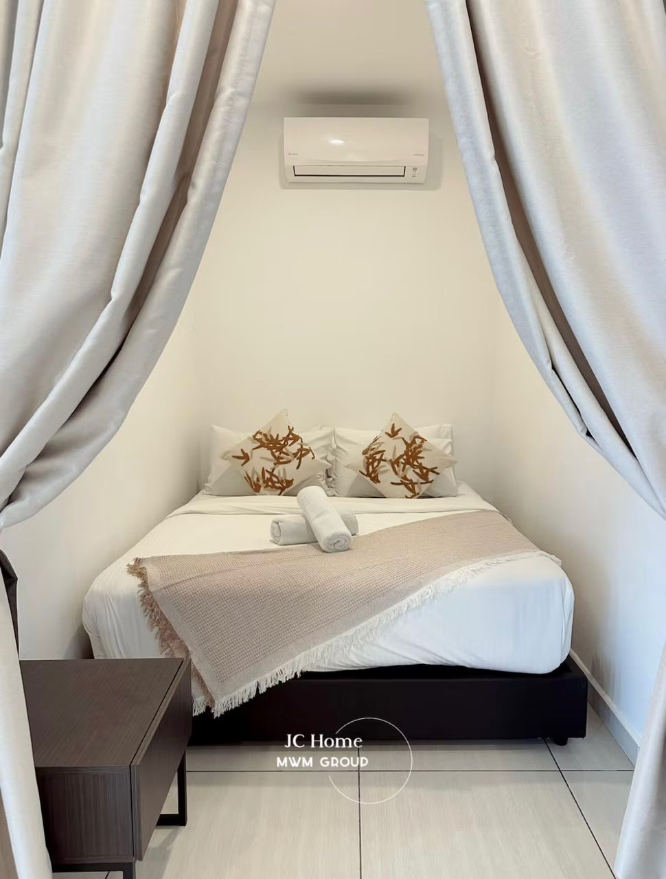 Compact room with draped bed