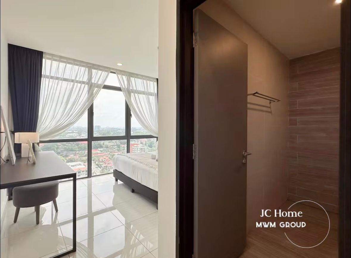 Room with city view and bathroom entrance